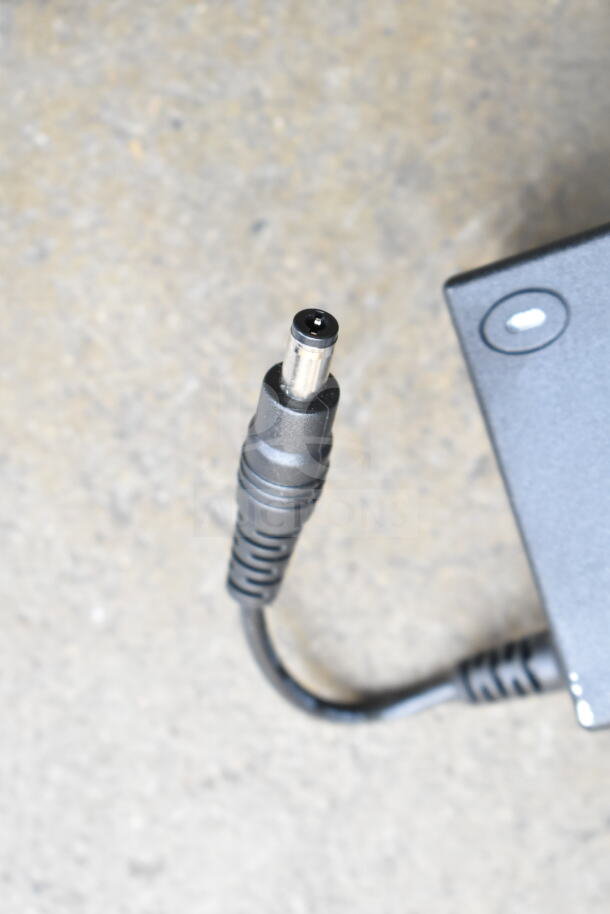 AC adapter with power cord for Nintendo Wii console, shown in used condition.