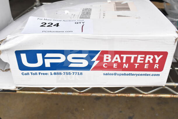 UPS TLV12180 Battery in original packaging. Visible UPS Battery Center logo and contact details. Box shows minor wear.