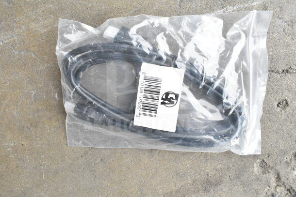 Lot of various cords and battery charger in a clear poly bin. Includes barcode and safety logo on packaging.
