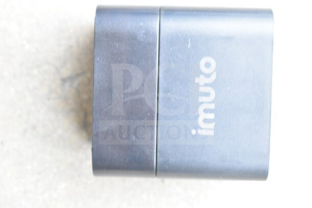 Clear poly bin with assorted cords and imuto battery charger, pre-owned, visible minor wear, valuable for tech setups.