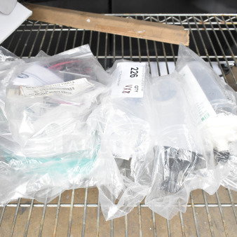Plastic bags containing Hatco R02.19.017.00 Infinite Switch and Salter Labs hoses on a metal shelf. Markings indicate lot of 8 items.