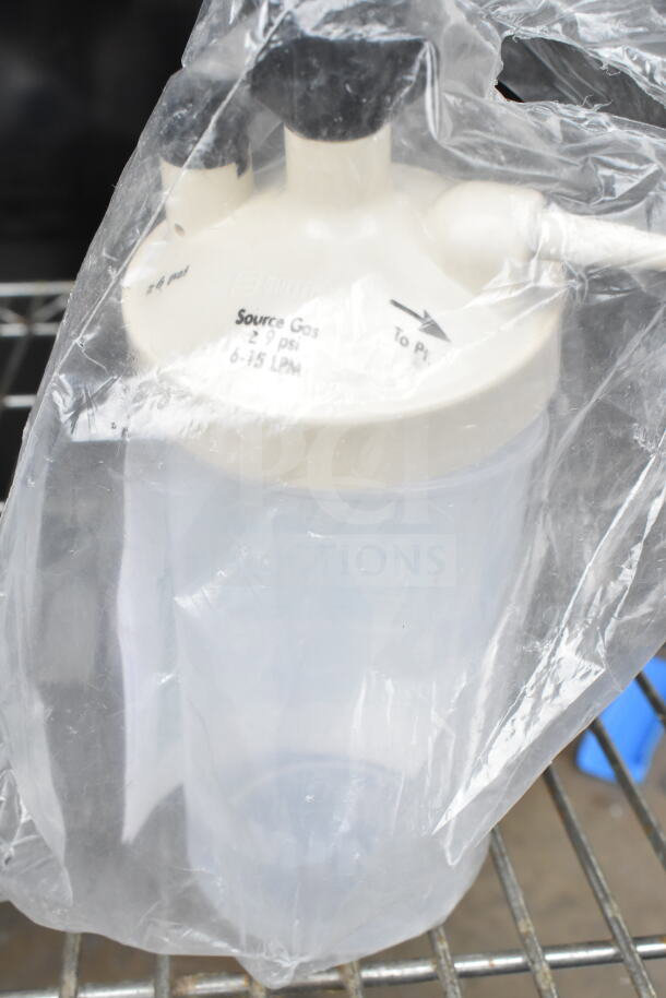 Clear plastic Salter Labs container with gas flow markings; 2-9 psi, 6-15 LPM. Part of an 8-item auction lot.
