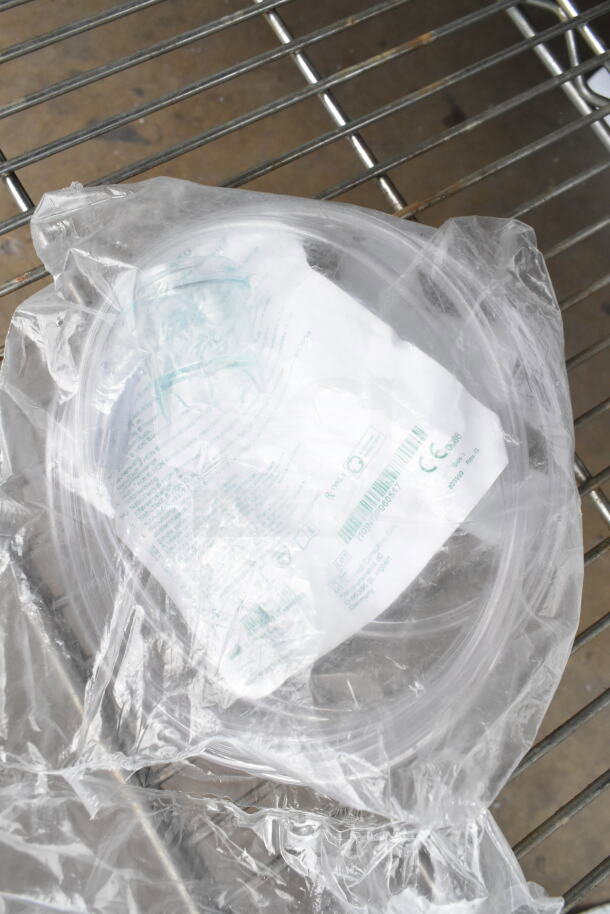 Plastic packaging containing Salter Labs hoses on a metal rack. Item is part of an auction lot with 8 varied items.