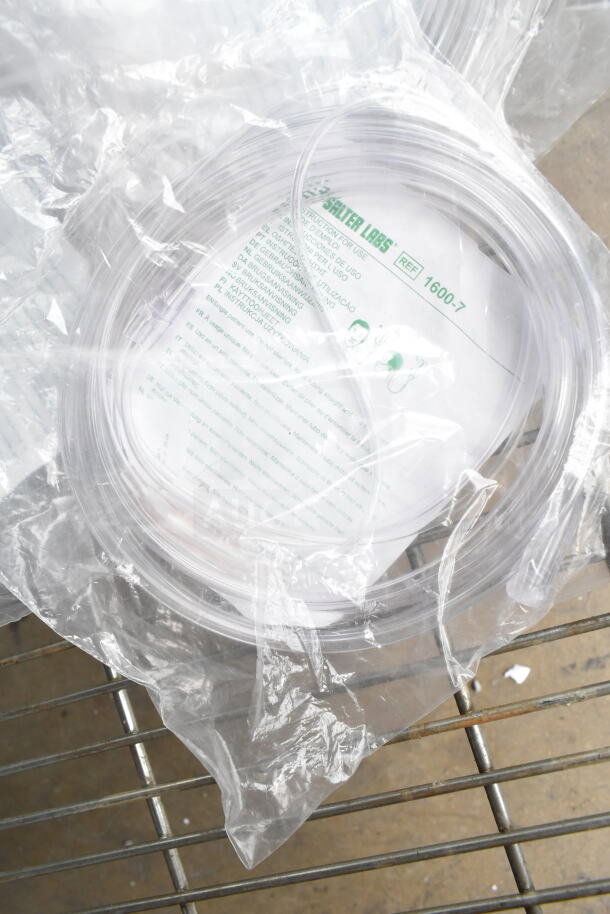 Clear plastic Salter Labs hoses with label visible, packed in a sealed plastic bag on a metal surface.
