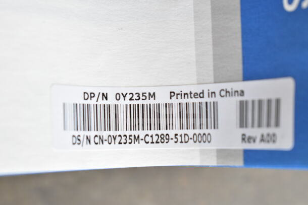Close-up of a label on DP/N 053D7M brackets. Label reads "DP/N 0Y235M, Printed in China, DS/N CN-0Y235M-C1289-51D-0000, Rev A00."