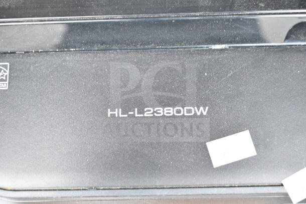 Brother HL-L2380DW all-in-one printer, scanner, copier. Visible model marking, 120V, 1 Phase. Dust present.