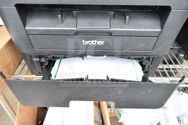 Brother HL-L2380DW printer, scanner, copier machine. Features 120 volts, 1 phase. Front tray open, black finish.