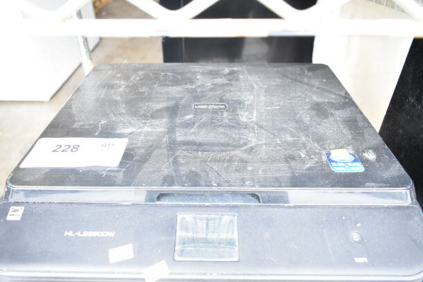 Brother HL-L2380DW printer scanner copier, 120 volts, 1 phase, visible wear, markings on lid, dusty condition.