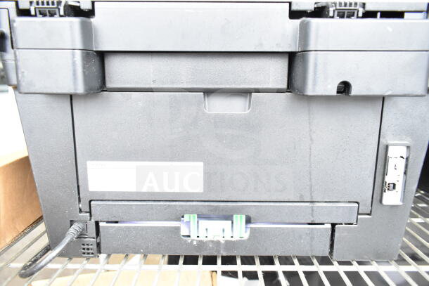 Brother HL-L2380DW printer-scanner-copier machine, back view. 120 volts, 1 phase. Visible power cable and USB port.