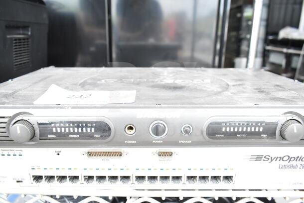 3 devices: Cradlepoint AER2200 router, Samson Servo 120a amplifier, SynOptics LattisHub 2814 hub, all shown in used condition.