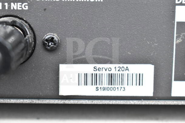 Close-up of Samson Servo 120A label with barcode. Item in good condition, part of a lot including Cradlepoint AER2200.