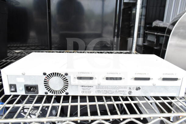SynOptics LattisHub 2814 with expansion ports, power switch, and fan, in good condition, model details visible on label.