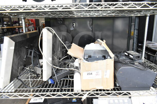 Five electronic items on a shelf, including two POS monitors, one Epson receipt printer, one Dell receipt printer, various cables, and a partially open cardboard box. Label shows "Qty 5" for auction lot 234.