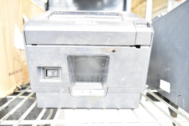 Dell receipt printer, used condition, visible wear. Power switch labeled "On/Off". Part of auction with 5 various items.