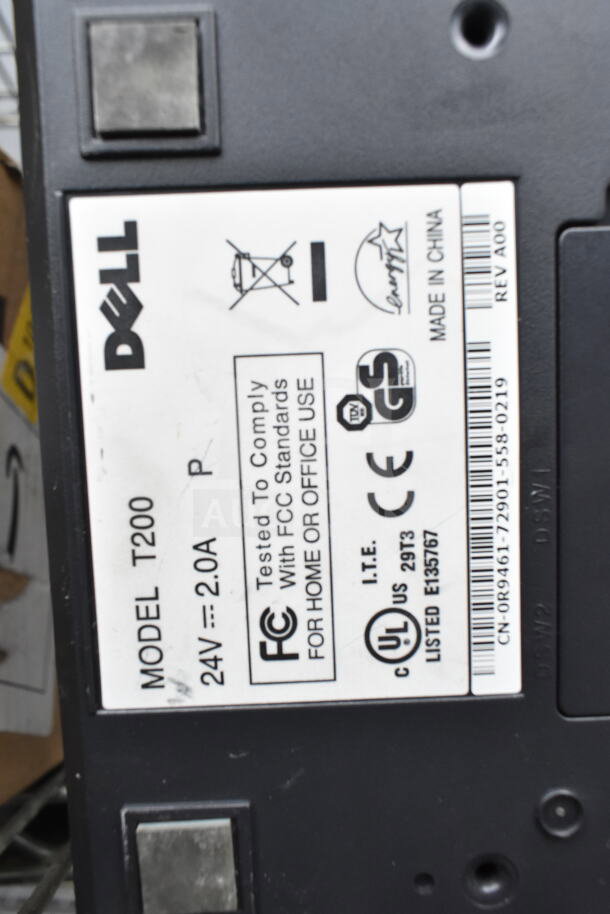 Dell model T200 label with compliance details, 24V, 2.0A. Features FCC standards, UL listed, and Made in China markings.