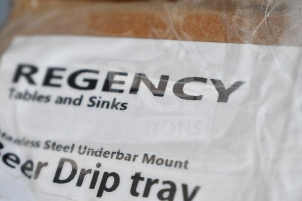 "Regency 600BDP30 beer drip tray, stainless steel, underbar mount, new condition with packaging showing brand label."