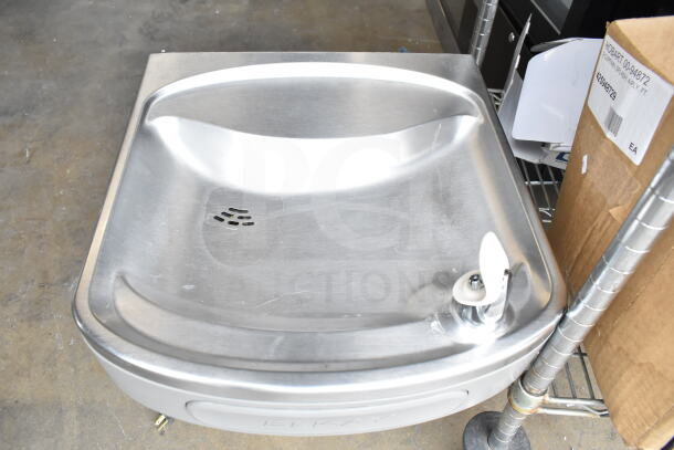 Elkay EZFSTL8 wall mount water fountain, stainless steel, used condition, visible Elkay branding on front panel.