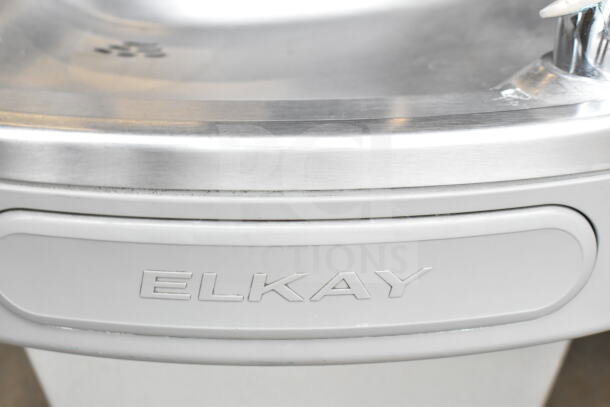 Elkay EZFSTL8 wall mount water fountain; stainless steel finish, Elkay logo visible, modern design, well-maintained.