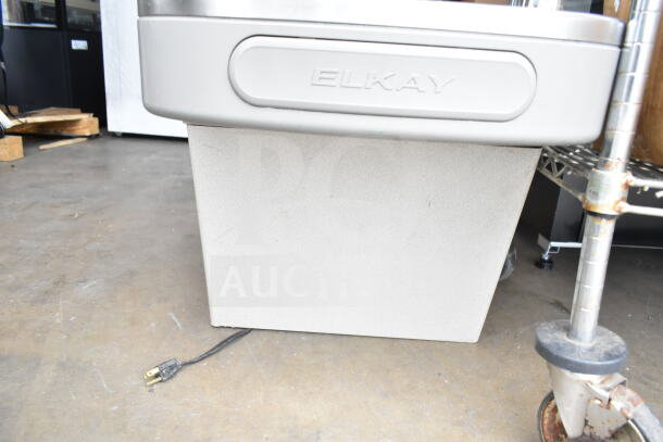 Elkay EZFSTL8 wall mount water fountain, gray, partial view, good condition, shows Elkay logo and power cord.