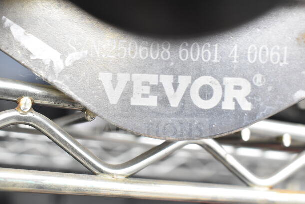 Vevor Countertop Vegetable Wedge Cutter close-up showing "S/N: 250608 6061 4 0061" marking on metal surface.