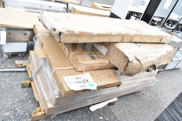 8 new scratch and dent items, including a Regency shelf and work table. Tags show lot JUN26-51, PCI label visible.