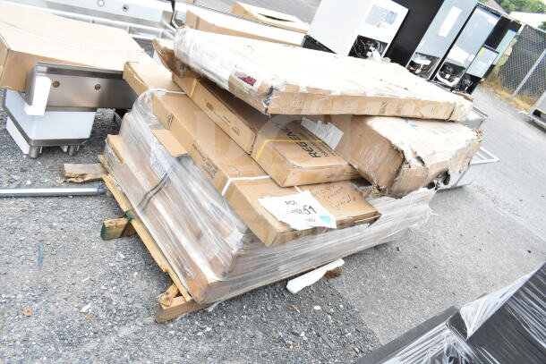 Pallet with eight boxed items including a shelf and work table, labeled "Regency." Boxes show scratch and dent.