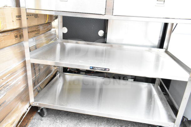Brand new Lakeside 3-tier stainless steel cart with commercial casters, minor scratches, ideal for efficient storage and mobility.