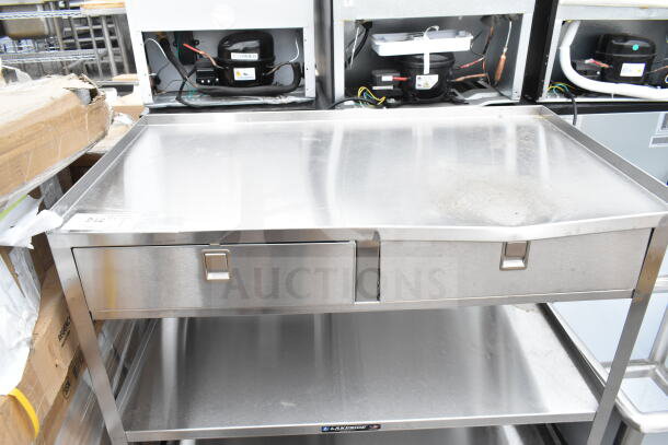 Brand new Lakeside 3-tier cart with commercial casters, minor scratches, stainless steel, drawers, durable for heavy-duty use.