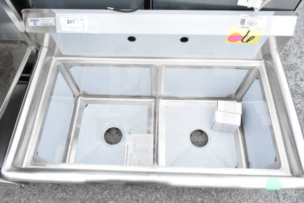 Brand new Steelton 522CS21717 two-compartment sink, 39.5", 17"x17"x12" bowls, no legs, minor scratches, visible tags.