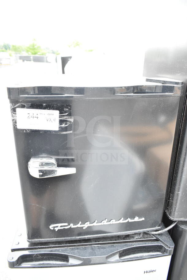 Four mini coolers, brands include Frigidaire, Haier, Hisense; 120 volts, 1 phase, visible Frigidaire logo and label "2447 QTY VX4".