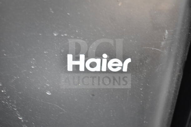 Haier logo on a mini cooler. Includes four coolers: Frigidaire, Haier, Hisense. 120 volts, 1 phase, auction set.