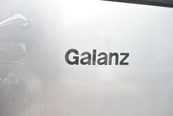Galanz mini cooler label on stainless steel. Part of auction with four 120V mini coolers including Sanyo and EdgeStar.