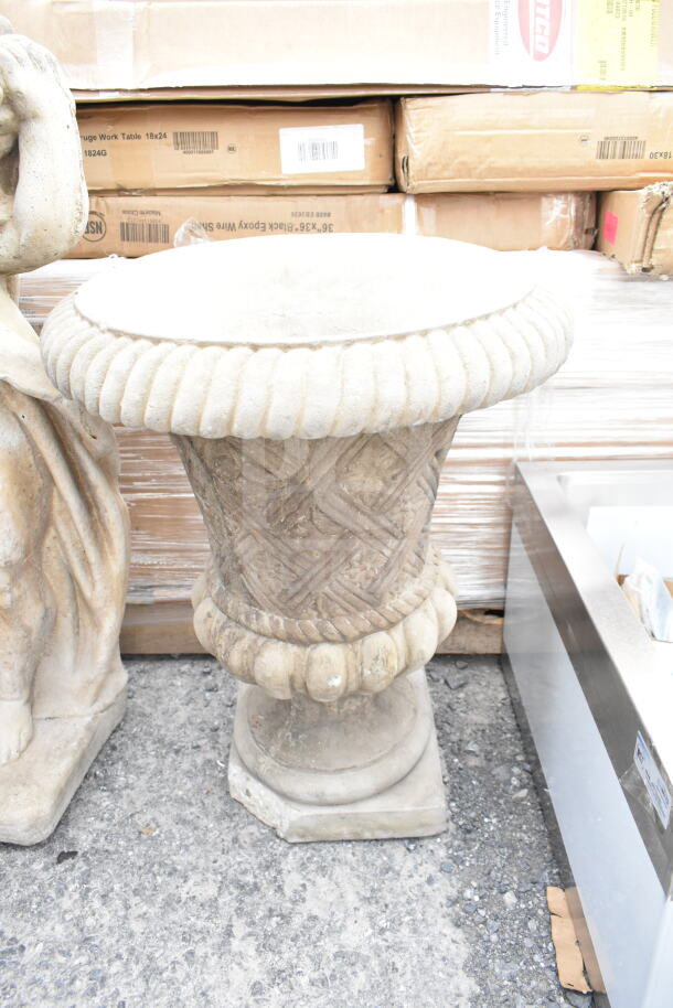 Stone statue and vase with intricate designs, weathered patina. Decorative items in rustic condition. Auction: 2 items per bid.