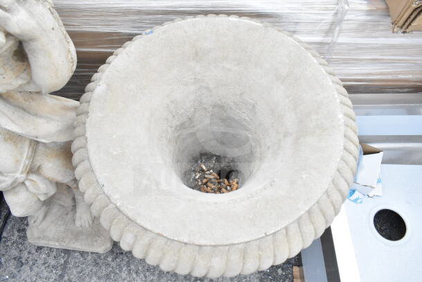 Stone statue and vase, with decorative ridges, used condition. Ash residue visible inside vase. Auction for 2 items.