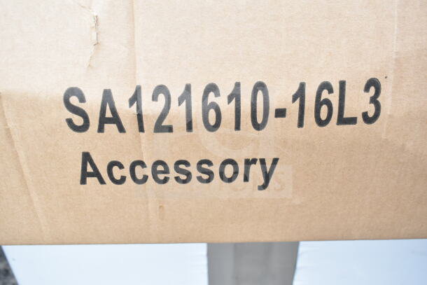 Cardboard box labeled "SA121610-16L3 Accessory," indicating packaging for a KoolMore 31-inch sink with drainboard.