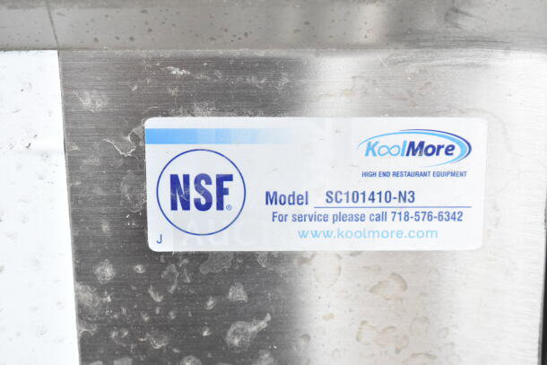 NSF label on KoolMore SC101410-N3 stainless steel sink indicating model and contact info for service.