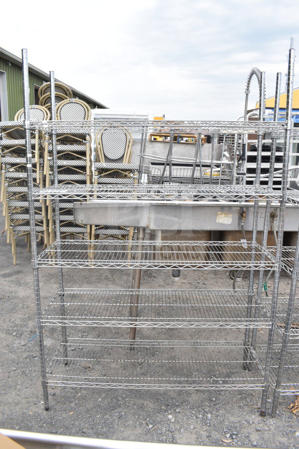 Chrome finish 5-tier wire shelving unit, dismantling required. Ideal for storing, measures approximately 72x48x18 inches.