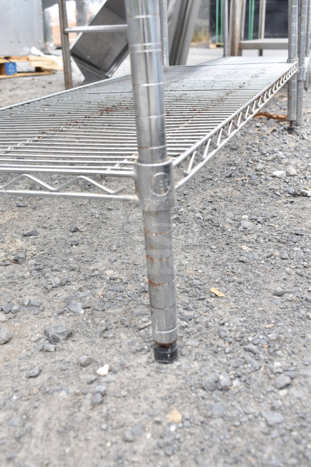 Chrome finish 5-tier wire shelving unit. Rust visible on metal. Buyer to dismantle. Ideal for storage and organization.