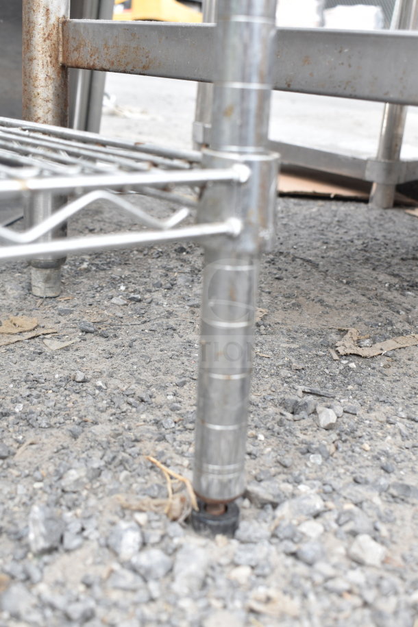 Chrome finish 5-tier wire shelving unit, sturdy metal construction, visible rust. Buyer must dismantle for shipping.