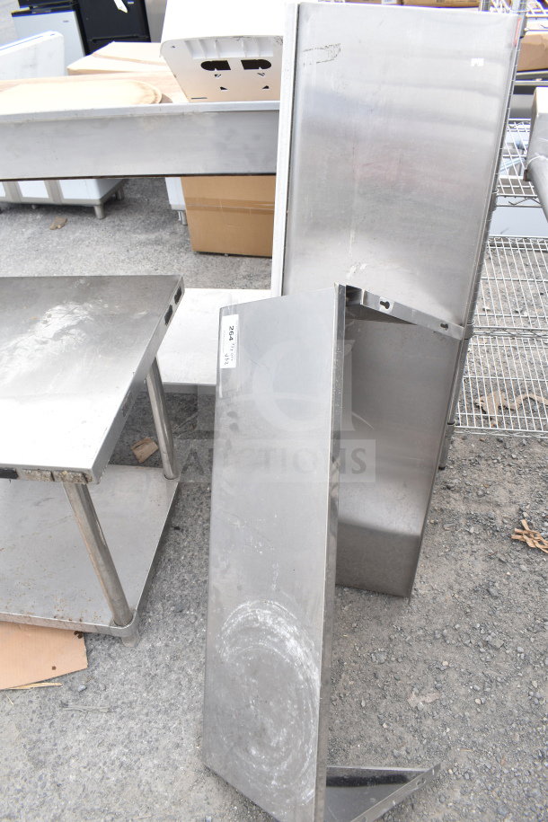 Two metal wall mount shelves, used condition, showing signs of wear, with visible label "260" on one shelf.