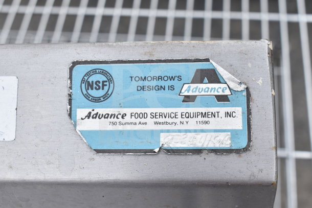 Commercial 3 Bay Sink by Advance, includes dual drain boards, faucet, spray nozzle. Label: NSF certified, Westbury, NY.