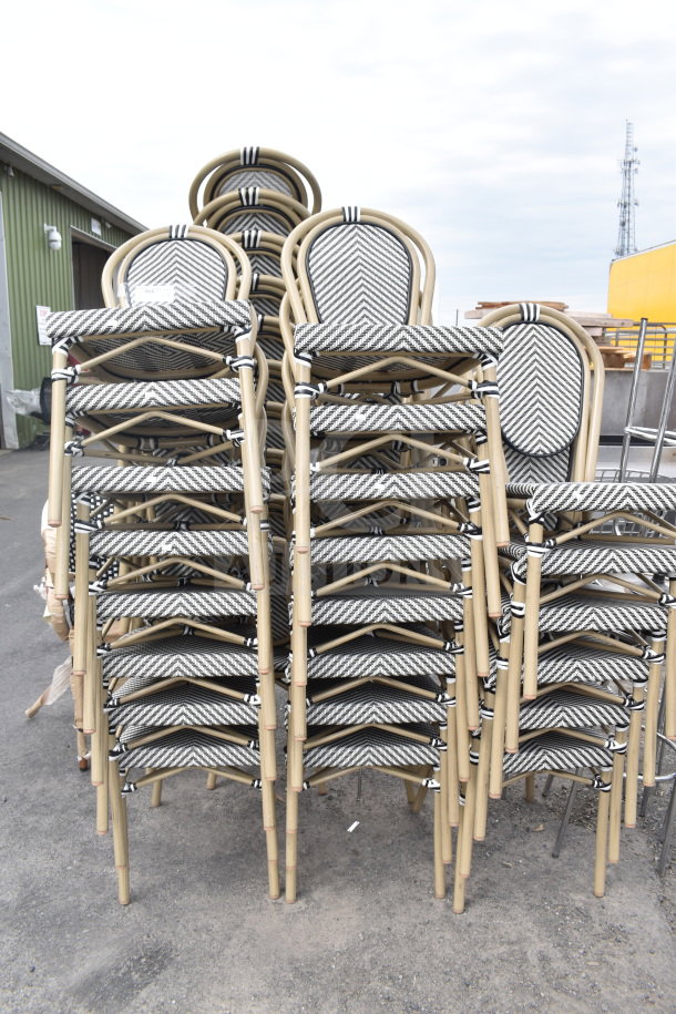 32 stackable outdoor chairs with bamboo-style frames and chevron patterned seats. Brand new, with minor scratches.