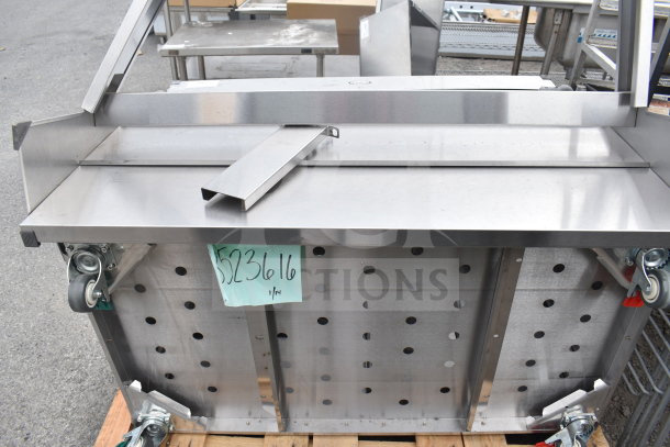 Cadco 523616 Serving Station, stainless steel, on casters, pristine condition, label indicating model number hanging.