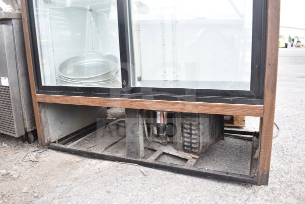 True GDM-47 commercial 2-door cooler, glass front, visible cooling unit, 115V, 1 phase, used condition.