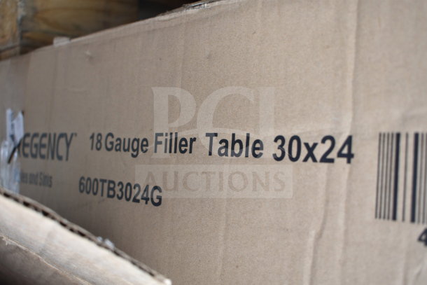 Cardboard box labeled "Regency 18 Gauge Filler Table 30x24, 600TB3024G" visible, indicating new equipment.