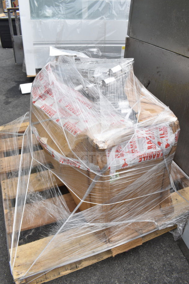 Pallet lot of chrome finish brackets, brand new scratch and dent, wrapped in clear plastic with "Fragile" labels.