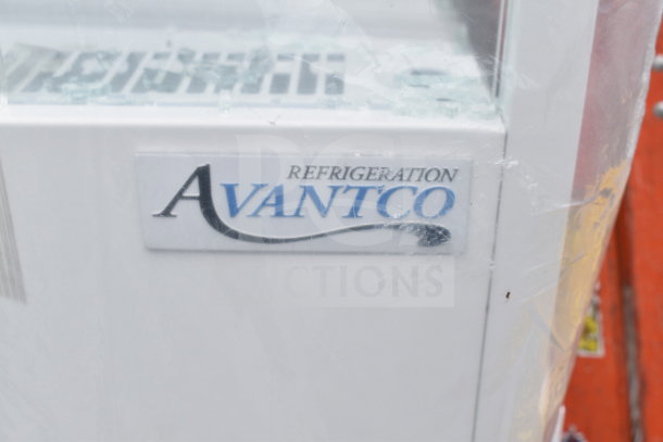 Brand new Avantco 193VOA60W white open air merchandiser with LED lighting. Features visible Avantco label. Glass damage noted.