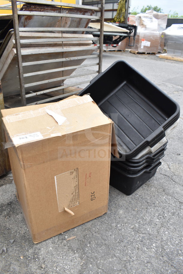 Lot with black poly bus bins stacked, cardboard box; outdoor setting, visible wear. Tags show "ALL ONE MONEY!" sale.