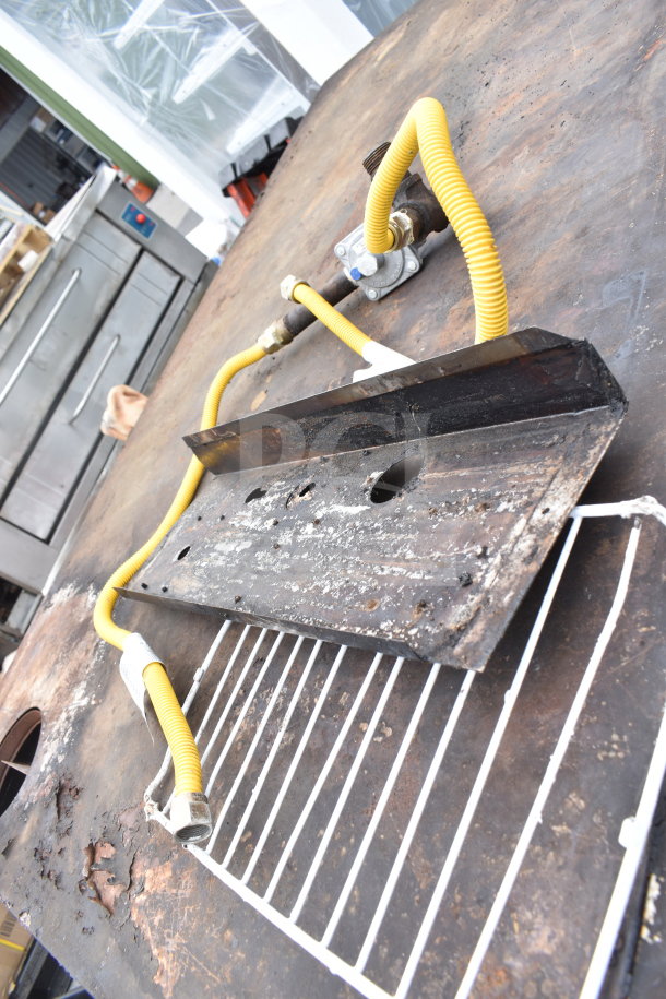 Bakers Pride commercial natural gas single deck pizza oven parts, featuring rust and corrosion, includes yellow gas hoses.