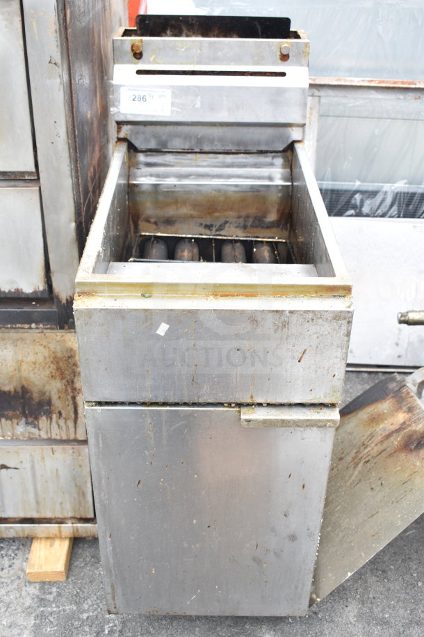 Commercial gas-powered floor style deep fat fryer, visible wear, robust design, identification tag with number 286 visible.